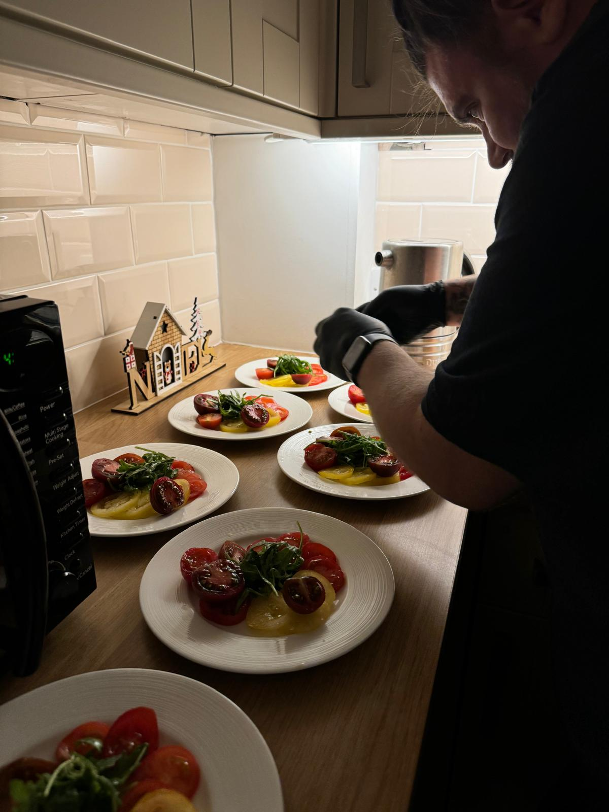 James and Amy, founders of Top Knot Chef, in their kitchen